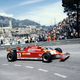 A red Ferrari 126C on the streets of Monaco in the 1980s.